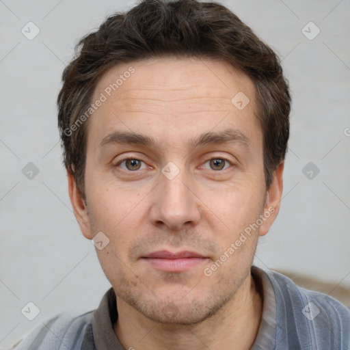 Joyful white adult male with short  brown hair and brown eyes