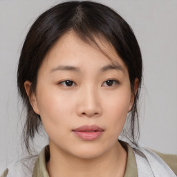 Neutral asian young-adult female with medium  brown hair and brown eyes