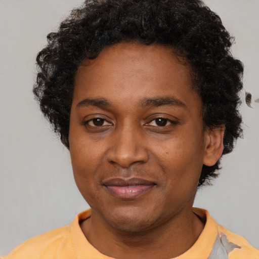 Joyful latino adult male with short  black hair and brown eyes