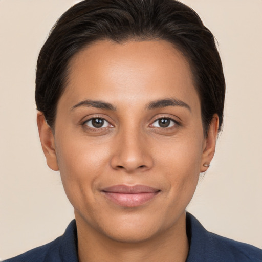 Joyful white young-adult female with short  brown hair and brown eyes