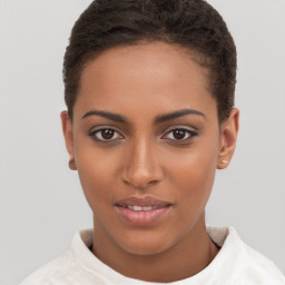 Joyful black young-adult female with short  brown hair and brown eyes