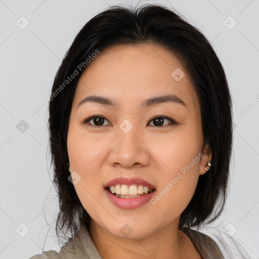 Joyful asian young-adult female with long  brown hair and brown eyes