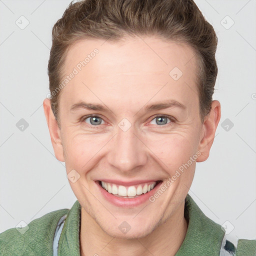 Joyful white adult female with short  brown hair and grey eyes