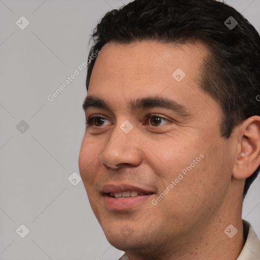 Joyful white young-adult male with short  black hair and brown eyes