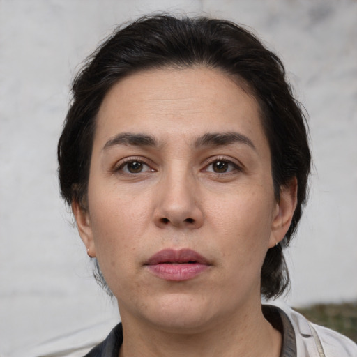 Neutral white young-adult female with medium  brown hair and brown eyes