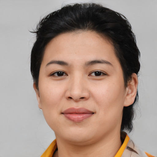 Joyful asian young-adult female with short  brown hair and brown eyes