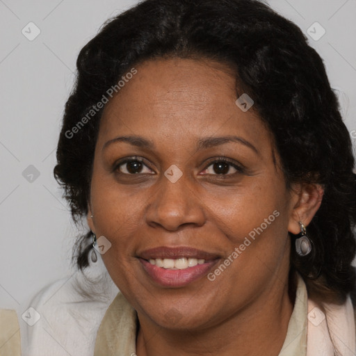 Joyful black adult female with medium  brown hair and brown eyes