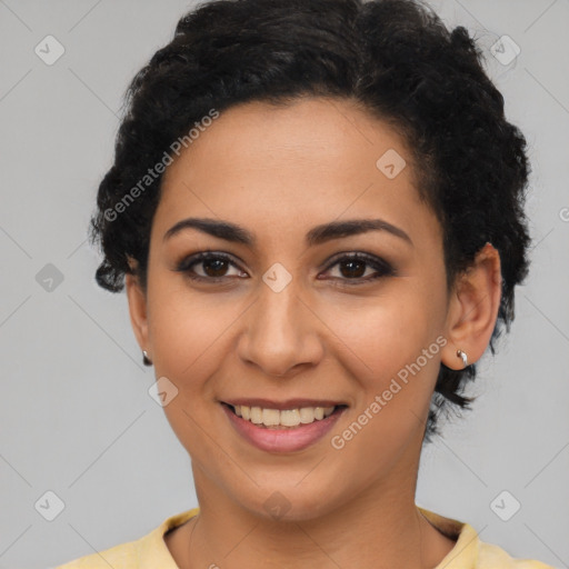 Joyful latino young-adult female with short  black hair and brown eyes