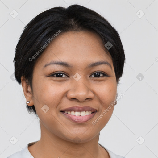 Joyful latino young-adult female with short  black hair and brown eyes