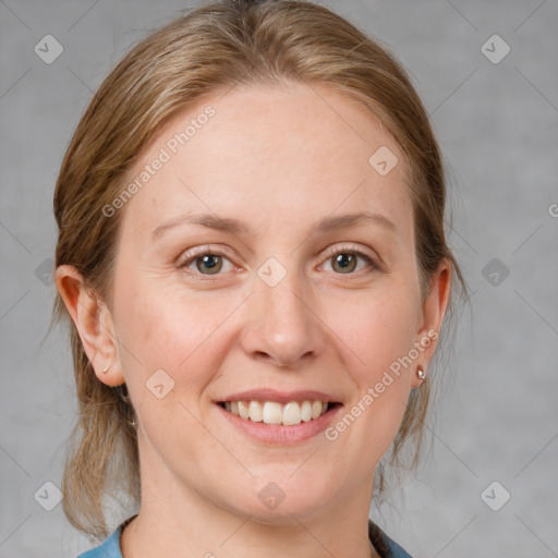 Joyful white young-adult female with medium  brown hair and blue eyes