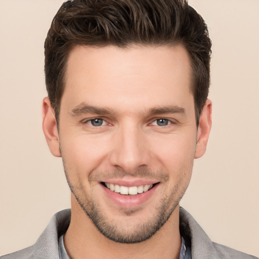 Joyful white young-adult male with short  brown hair and brown eyes