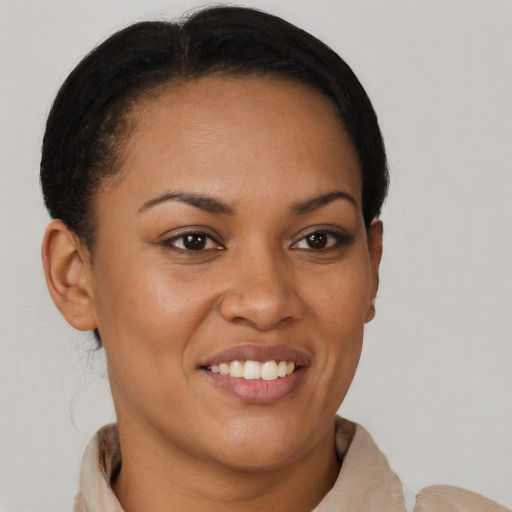 Joyful latino young-adult female with short  brown hair and brown eyes