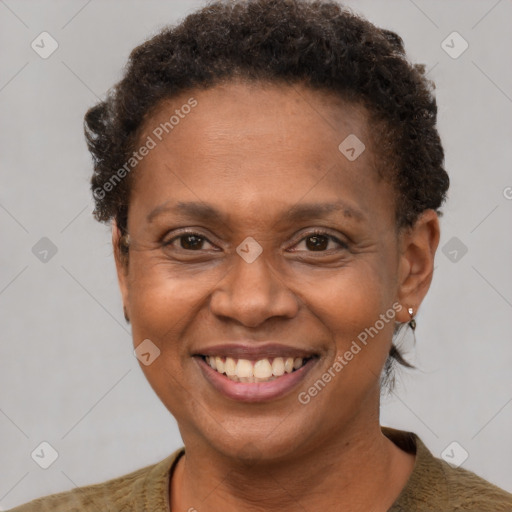 Joyful black adult female with short  brown hair and brown eyes