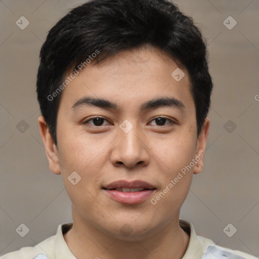 Joyful asian young-adult male with short  black hair and brown eyes