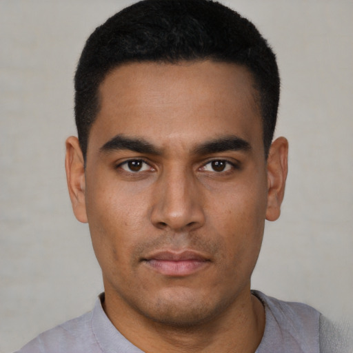 Neutral latino young-adult male with short  black hair and brown eyes