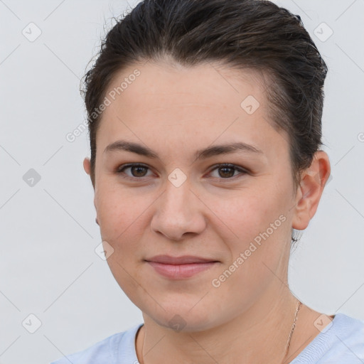 Joyful white young-adult female with short  brown hair and brown eyes