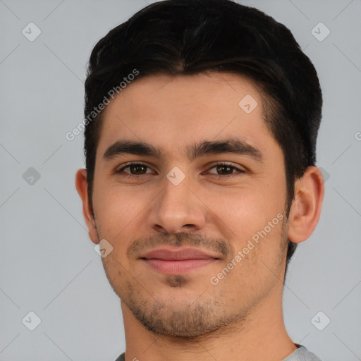 Joyful white young-adult male with short  black hair and brown eyes