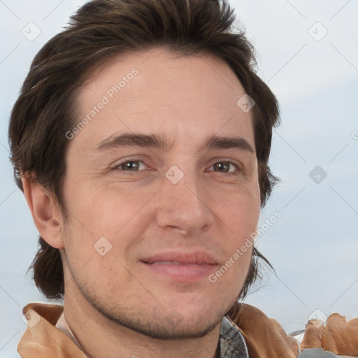 Joyful white adult male with short  brown hair and brown eyes