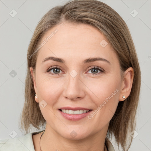 Joyful white young-adult female with medium  brown hair and grey eyes