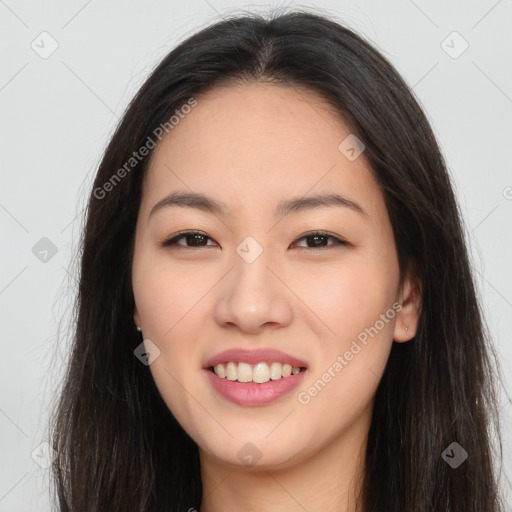 Joyful asian young-adult female with long  brown hair and brown eyes