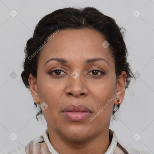 Joyful black adult female with short  brown hair and brown eyes