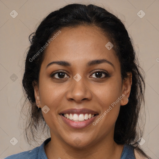 Joyful latino young-adult female with long  brown hair and brown eyes