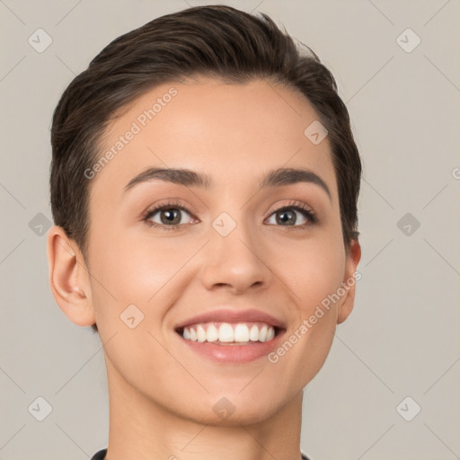 Joyful white young-adult female with short  brown hair and brown eyes