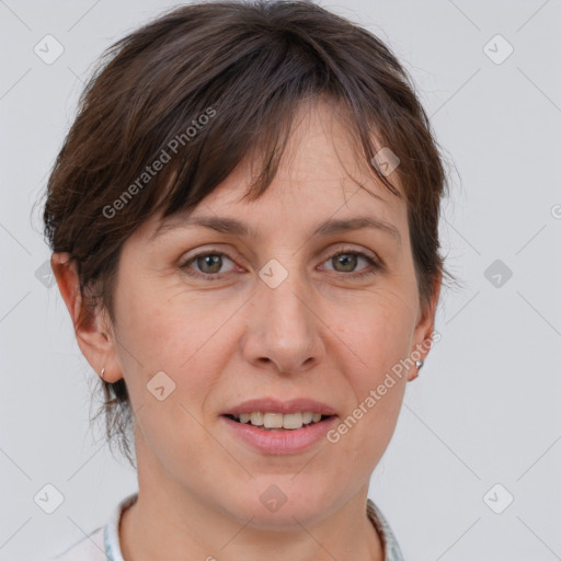 Joyful white adult female with short  brown hair and grey eyes