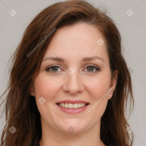 Joyful white young-adult female with long  brown hair and green eyes