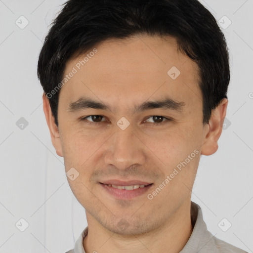 Joyful asian young-adult male with short  brown hair and brown eyes