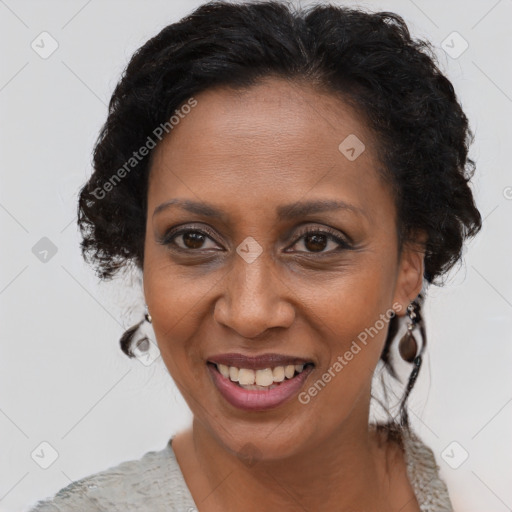 Joyful black adult female with short  brown hair and brown eyes