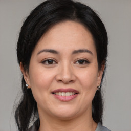 Joyful white young-adult female with medium  brown hair and brown eyes