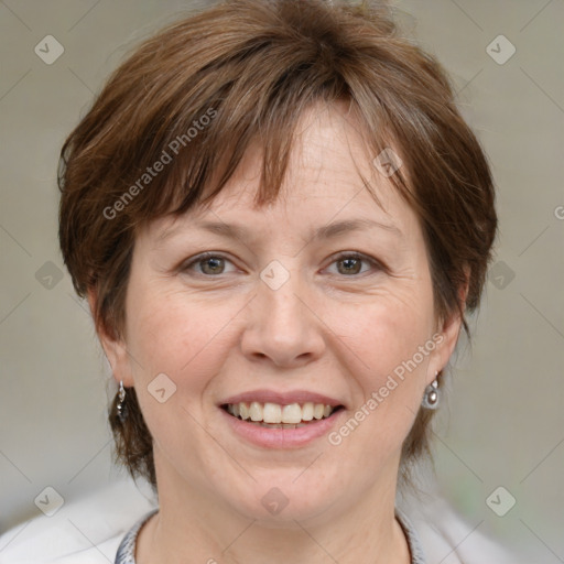 Joyful white adult female with medium  brown hair and blue eyes