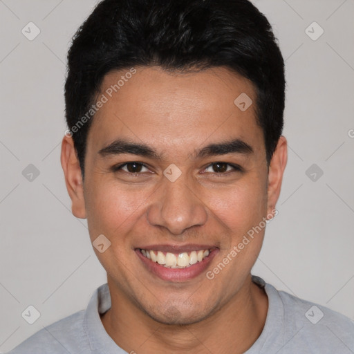 Joyful white young-adult male with short  black hair and brown eyes