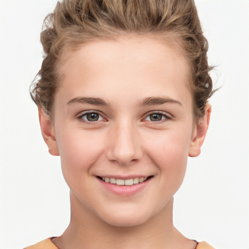 Joyful white child female with short  brown hair and brown eyes