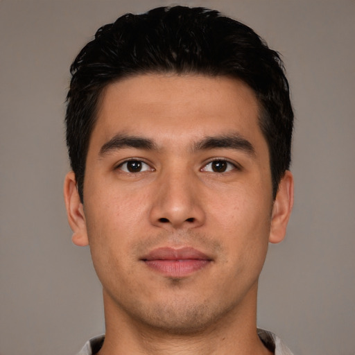 Joyful asian young-adult male with short  black hair and brown eyes