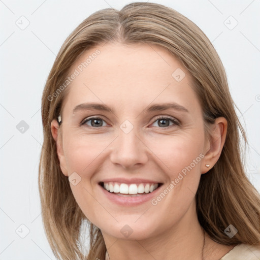 Joyful white young-adult female with long  brown hair and blue eyes