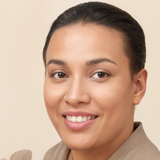 Joyful white young-adult female with short  brown hair and brown eyes