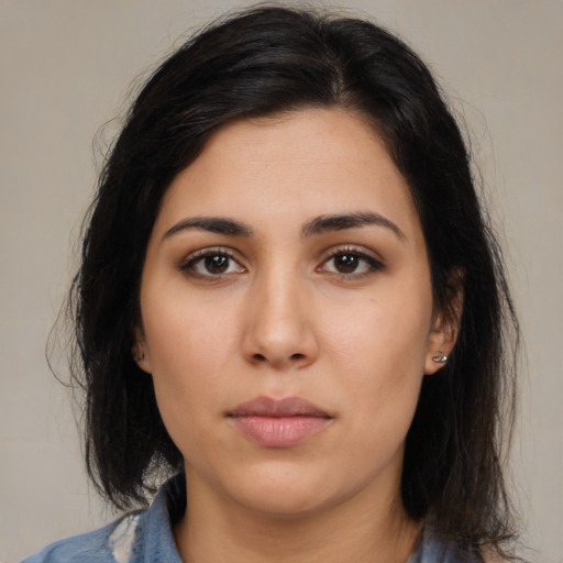 Neutral latino young-adult female with medium  black hair and brown eyes