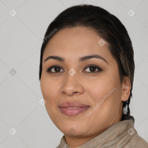 Joyful latino young-adult female with long  brown hair and brown eyes