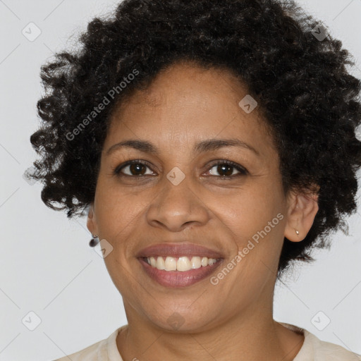 Joyful black adult female with short  brown hair and brown eyes