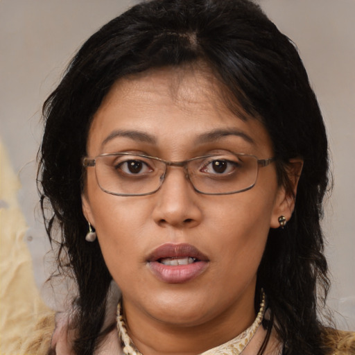 Joyful asian adult female with medium  brown hair and brown eyes