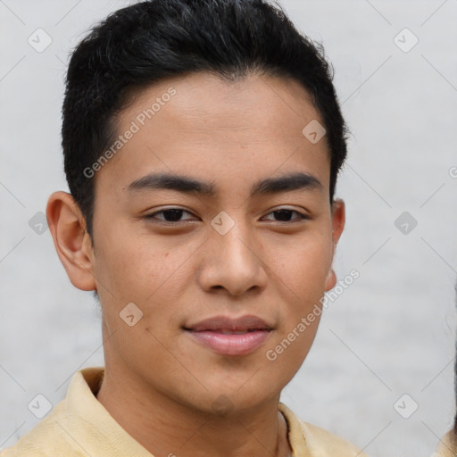 Joyful latino young-adult male with short  brown hair and brown eyes