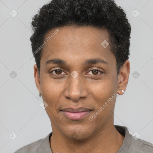 Joyful black young-adult male with short  black hair and brown eyes