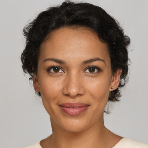Joyful latino young-adult female with short  brown hair and brown eyes