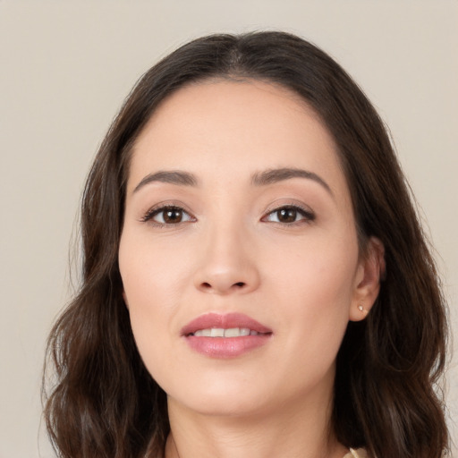 Joyful white young-adult female with long  brown hair and brown eyes