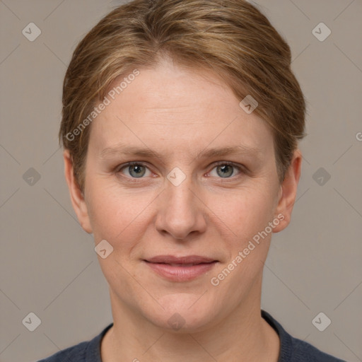 Joyful white adult female with short  brown hair and grey eyes