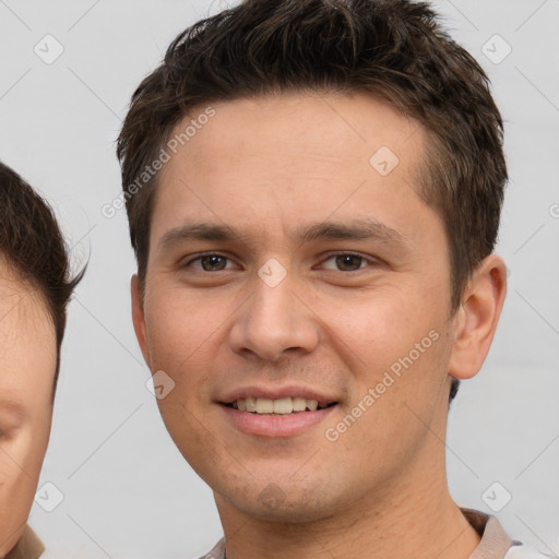 Joyful white young-adult male with short  brown hair and brown eyes