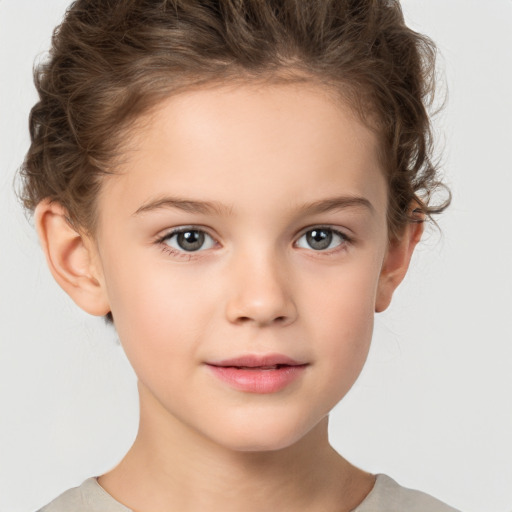 Joyful white child female with short  brown hair and brown eyes