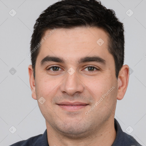 Joyful white young-adult male with short  black hair and brown eyes